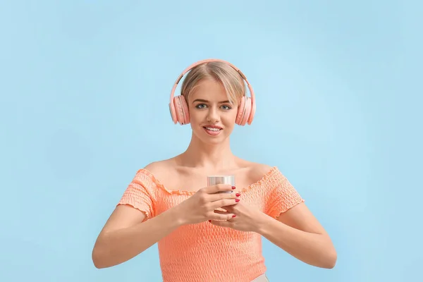 Young Woman Headphones Holding Wireless Portable Speaker Blue Background — Stock Photo, Image