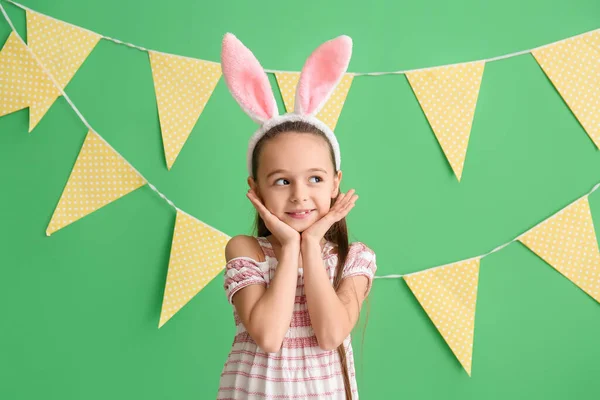 Pretty Girl Bunny Ears Looking Aside Green Background — Stock Photo, Image