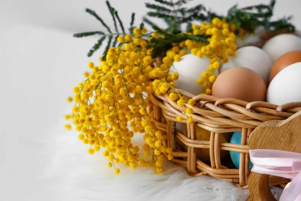 Wicker Basket Mimosa Flowers Easter Eggs Shelf Light Wall Closeup — Stock Photo, Image