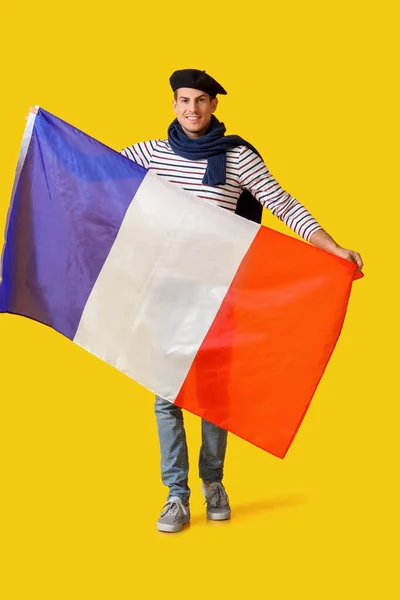 Joven Guapo Con Bandera Francia Sobre Fondo Amarillo — Foto de Stock