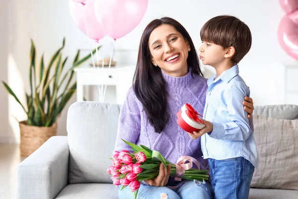 Little son greeting his mother for International Women\'s day at home