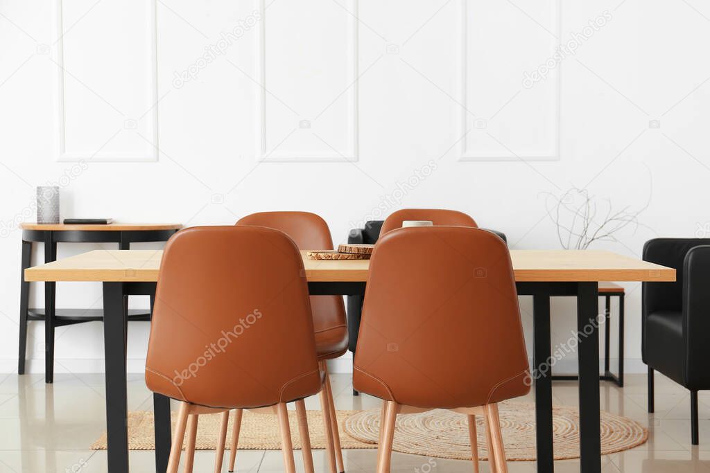 Dining table with chairs in light room