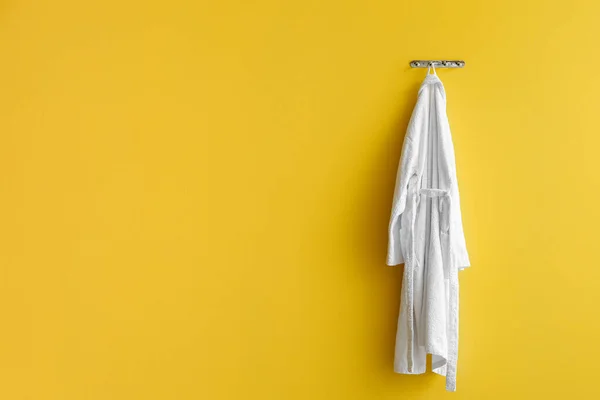 White Bathrobe Hanging Yellow Wall — Stock Photo, Image