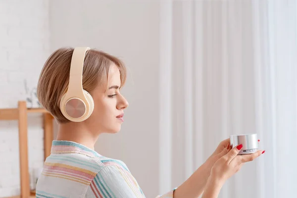 Woman Modern Headphones Holding Wireless Portable Speaker Light Room — Stock Photo, Image