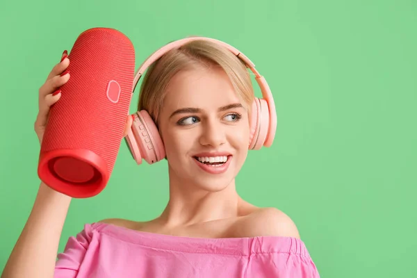 Happy Woman Headphones Holding Wireless Portable Speaker Looking Aside Green — Stock Photo, Image