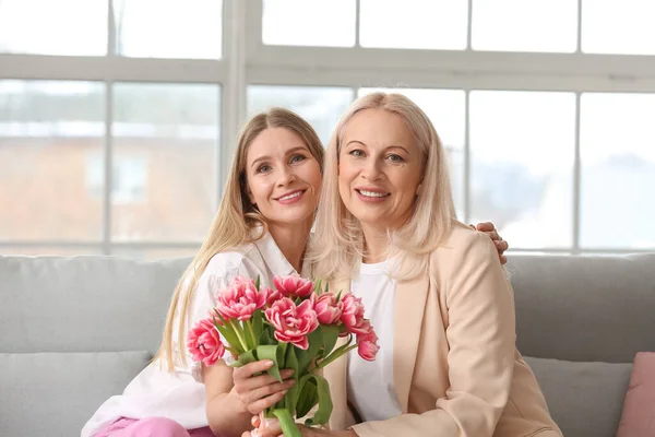 Young Woman Greeting Her Mother Bouquet Tulips Home Holiday — Stock Photo, Image