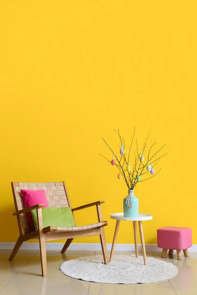 Tree Branches Easter Eggs Vase Table Armchair Pouf Yellow Wall — Stock Photo, Image