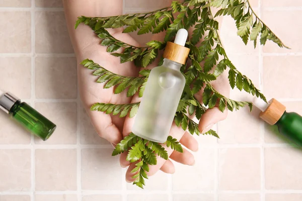 Female Hands Bottle Serum Light Tile Background — Stock Photo, Image