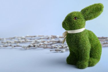 Cute Easter bunny and pussy willow branches on grey background