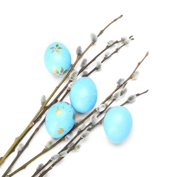 Easter eggs and pussy willow branches isolated on white