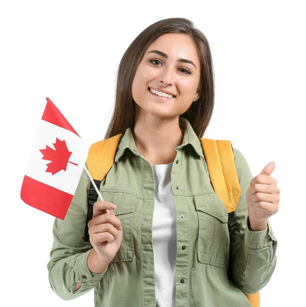拿着加拿大国旗的年轻女生在白种人背景上表现出大拇指向上的姿态 — 图库照片