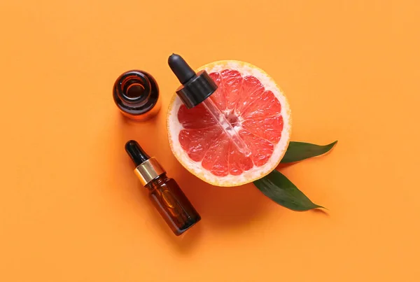 Bottles Essential Oil Half Grapefruit Color Background — Stock Photo, Image