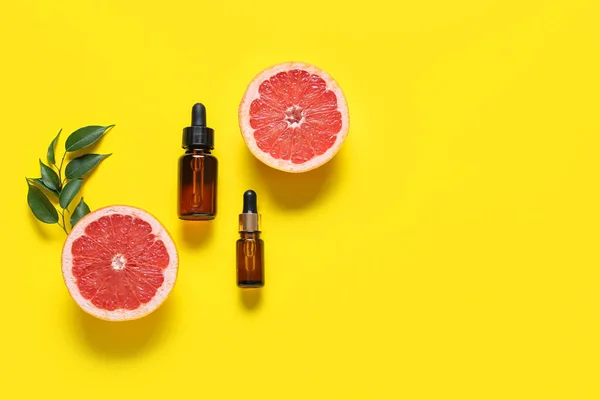 Composition Bottles Essential Oil Grapefruit Yellow Background — Stock Photo, Image