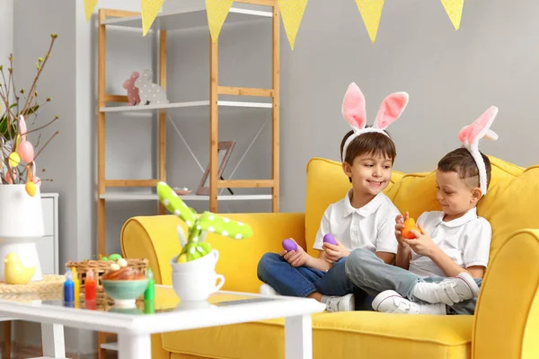 Cute Little Boys Bunny Ears Easter Eggs Sitting Sofa Home — Stock Photo, Image