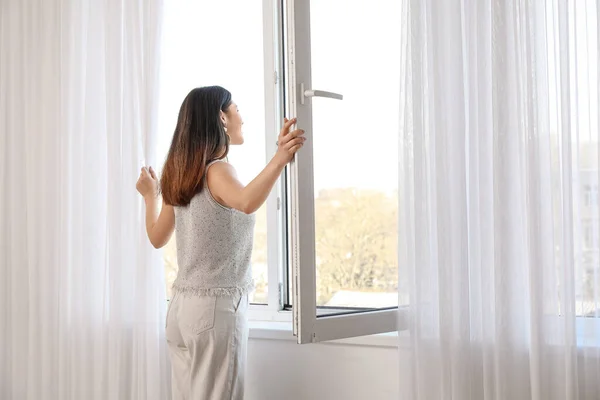 Pretty Young Asian Woman Opening Window Home — Stock Photo, Image