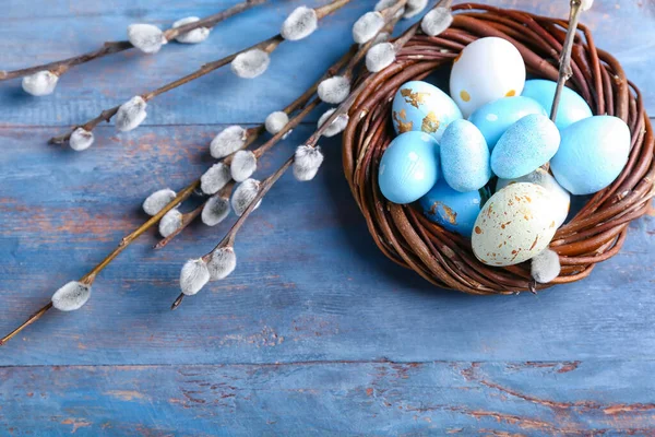 Nest Painted Easter Eggs Pussy Willow Branches Blue Wooden Background — Stock Fotó