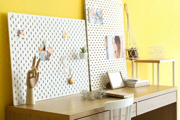 Stylish Workplace Peg Board Yellow Wall Background — Stock Photo, Image