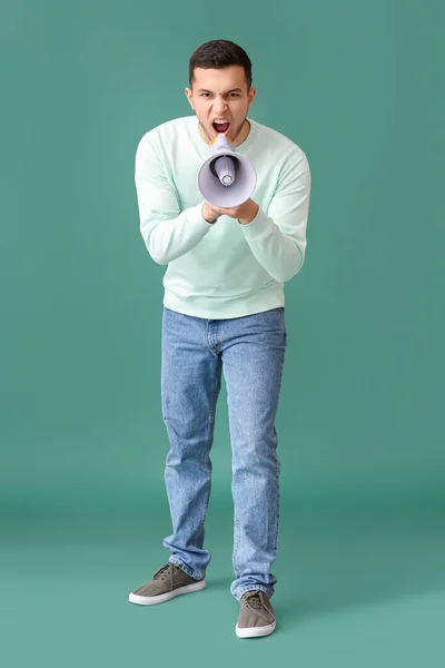 Angry Young Man Shouting Megaphone Green Background — Stock Photo, Image