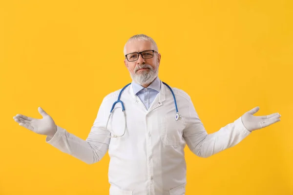 Mature Male Doctor Eyeglasses Stethoscope Yellow Background — Stock Photo, Image