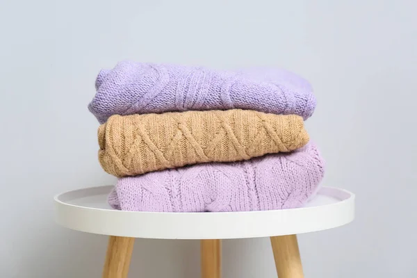 Stack Knitted Sweaters Table Light Wall — Stock Photo, Image