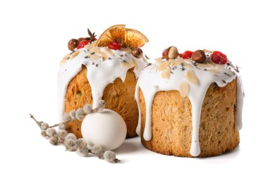 Delicious Easter cakes, pussy willow branch and egg isolated on white background