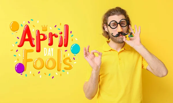 Funny Young Man Disguise Party Whistle Yellow Background April Fools — Stock Photo, Image