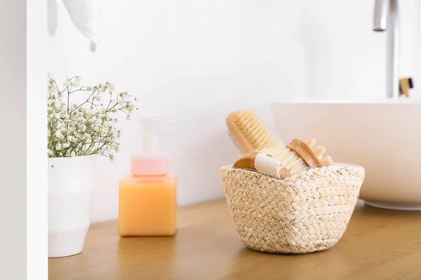 Basket Different Body Massage Brushes Table White Wall — Stock Photo, Image