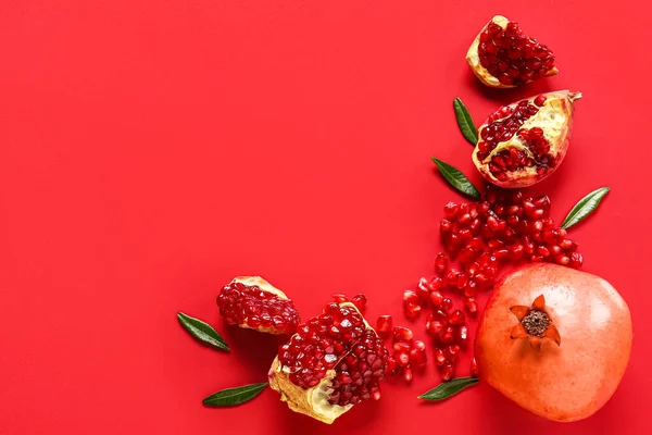 Tasty Ripe Pomegranate Pieces Red Background — Stock Photo, Image