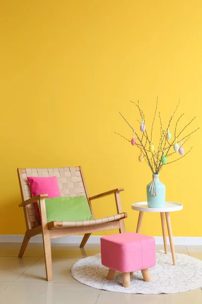 Tree Branches Easter Eggs Vase Table Armchair Pouf Yellow Wall — Stock Photo, Image