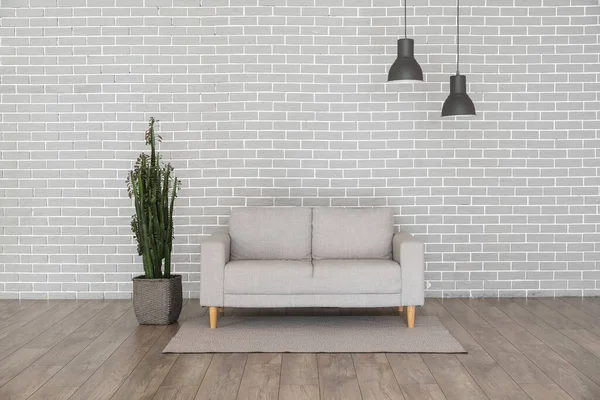 Modern Sofa Cactus Grey Brick Wall — Stock Photo, Image