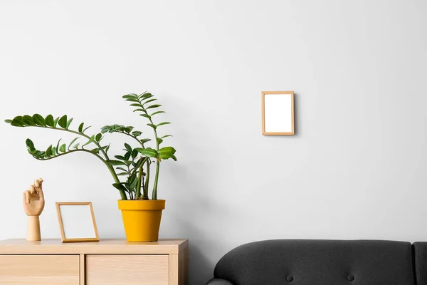 Blank Frames Wooden Hand Houseplant Table Sofa Light Wall — Stock Photo, Image