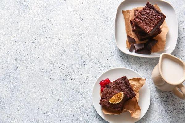 Plates Pieces Delicious Chocolate Brownie Light Background — Stock Photo, Image