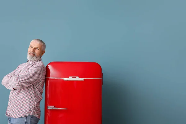 Mature Man Red Fridge Blue Background — Stock Photo, Image