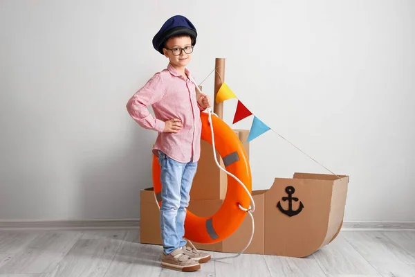 Funny Little Boy Playing Cardboard Ship Lifebuoy Home — Stock Photo, Image