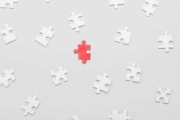 Red Puzzle Piece White Ones Light Background Concept Autistic Disorder — Stock Photo, Image