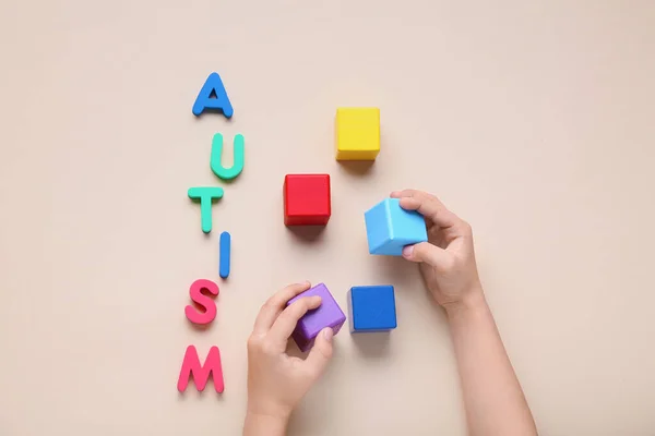 Child Cubes Word Autism Beige Background — Stock Photo, Image