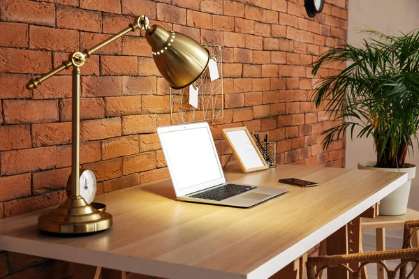Glowing Lamp Modern Laptop Mobile Phone Wooden Table Brick Wall — Stock Photo, Image
