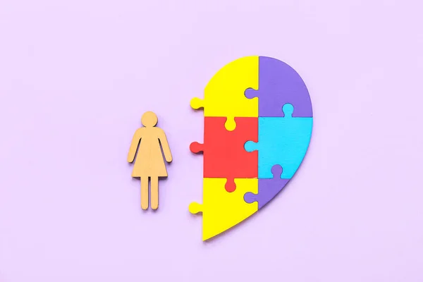 Wooden Female Figure Puzzle Pieces Lilac Background Concept Autistic Disorder — Stock Photo, Image