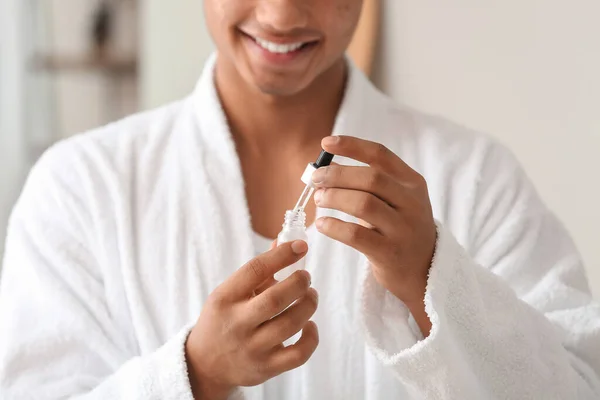 Young African American Guy Using Serum Skin Care Bathroom Closeup — Stock Photo, Image