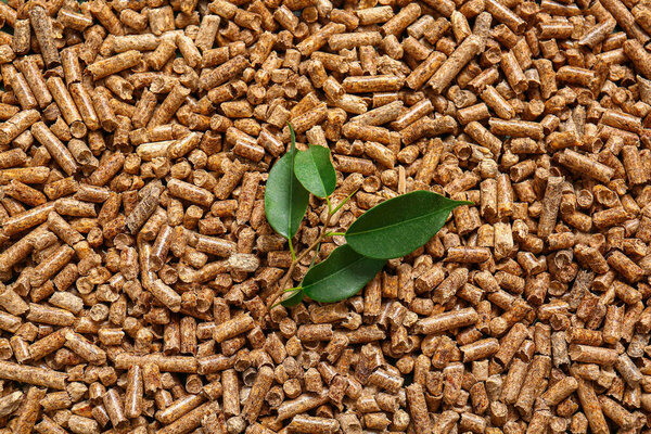 Wood pellets and leaves as background
