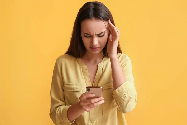 Displeased Young Woman Mobile Phone Yellow Background — Stock Photo, Image