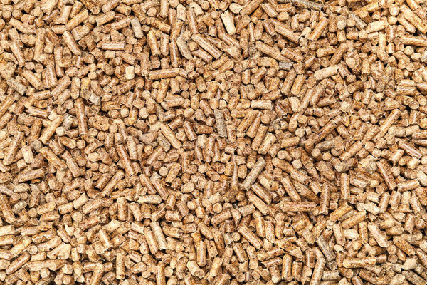 Деревянные гранулы в качестве фона, вид сверху