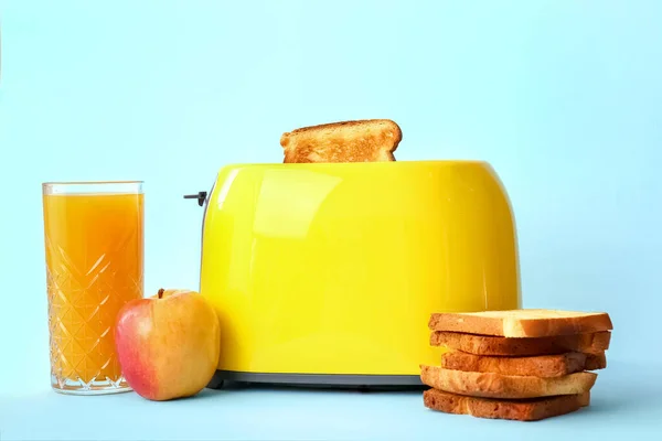 Modern Toaster Bread Slices Glass Juice Apple Blue Background — Stock Photo, Image