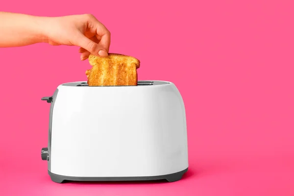 Woman Taking Bread Slice Toaster Pink Background — Stock Photo, Image