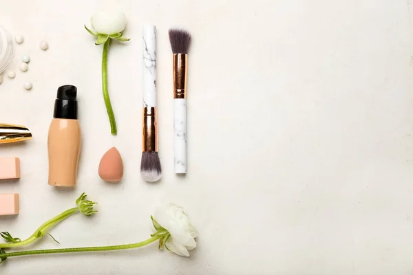 Decorative Cosmetics Makeup Brushes Sponge Ranunculus Flowers Light Background — Stock Photo, Image