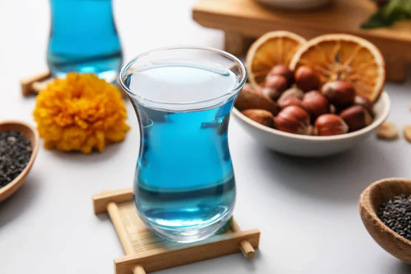 Cup Blue Tea Nuts Light Background Closeup — Stock Photo, Image