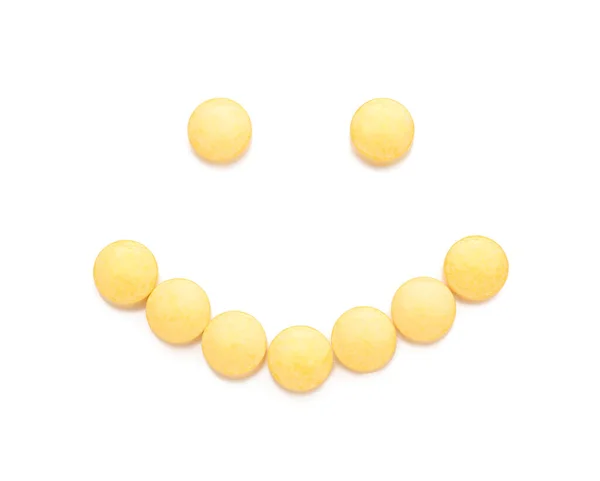 Lykkelig Smiley Laget Gule Piller Hvit Bakgrunn – stockfoto