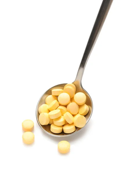 Lžíce Žlutými Pilulky Bílém Pozadí — Stock fotografie