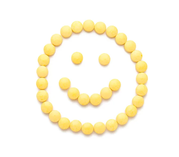 Χαρούμενο Χαμόγελο Από Κίτρινα Χάπια Λευκό Φόντο — Φωτογραφία Αρχείου