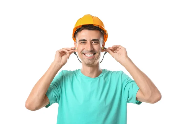 Smiling Young Builder Hardhat Putting Earplugs White Background — Stock Photo, Image